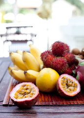 Assortment of tropical exotic fruits: dragonfruit, bananas, passion , longan, rambutan 