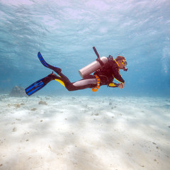 Silhouette of Scuba Diver near Sea Bottom