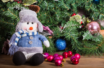 New Year composition with a snowman and balls