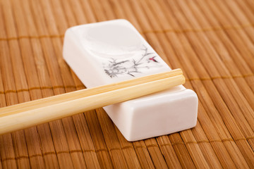 Chopsticks on a white stand