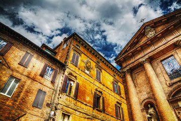 Fototapeta na wymiar San Cristoforo church and historic buildings in Siena