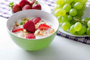 Homemade fruit plate with yogurt, strawberries and granola