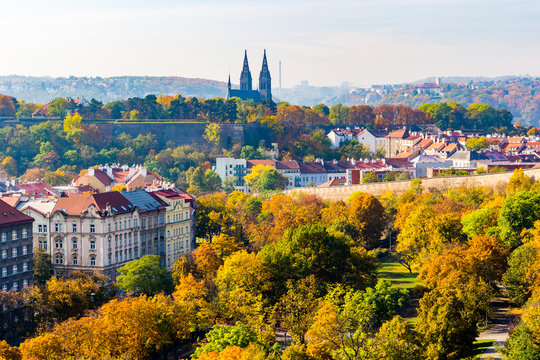 view of prague in autumn taken from Nuselsky bridge captures typical local architecture from aerial perspective. Famous Vysehrad castle is behind it.