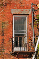 Fototapeta na wymiar Abandoned Urban Apartment Building in Disrepair