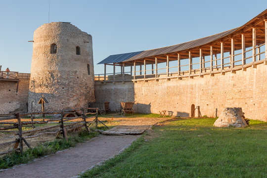 View of the interior of the Izborsk fortress and tower Lukovka in the summer evening