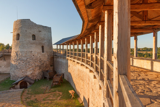 View from the fortress wall of the ancient fortress in Izborsk on the interior of the summer evening 