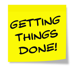 Getting Things Done written on a yellow sticky note