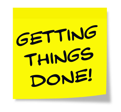 Getting Things Done Written On A Yellow Sticky Note