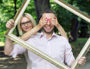 Conceptual picture of the couple holding a frame