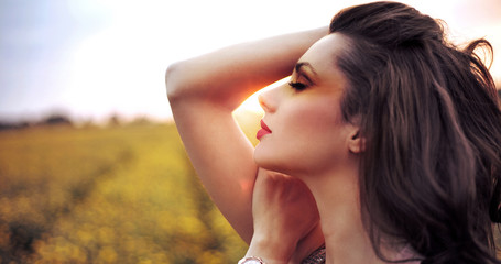 Adorable woman resting on the corn field © konradbak