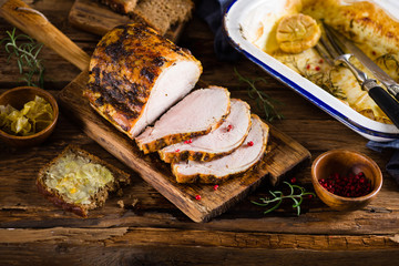 Roasted pork loin on the old wooden table