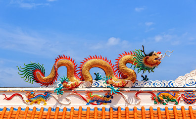 Golden Dragon against Blue Sky Background, Close-up