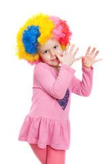 a little girl with clown wig