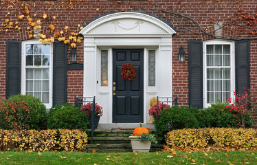 Obraz premium house front door in fall