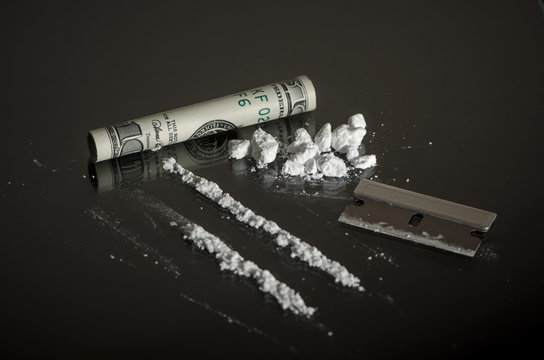 Recreational Drugs on Glass Table - Substance Abuse Concept