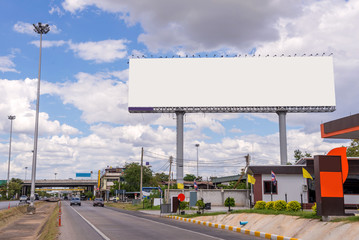 large blank billboard on road with city view background