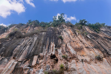 Rocky cliff at mountain in Laos with sky