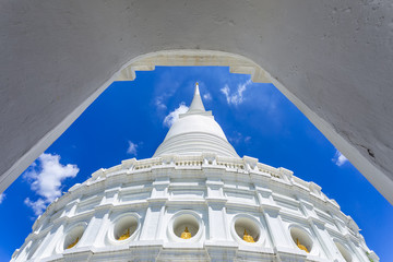 White pagoda against blue sky and clouds in Wat-Prayoon Rawongsa