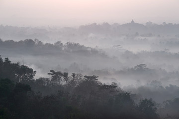 Mist above Borobudur as viewed from Setumbu  hill