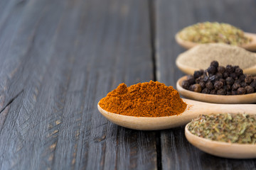 Spices and herbs in  bowls.