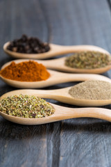 Spices and herbs in  bowls.