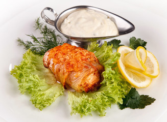 meat with sauce and  lemon
