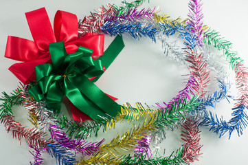 red and green ribbon with rainbow line on white background. merr