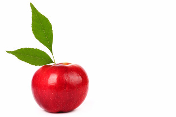 Fresh red apple with green leaf isolated on white