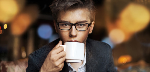 Elegant guy drinking a coffee