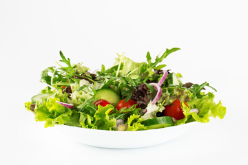 Fresh salad in a plate isolated on white