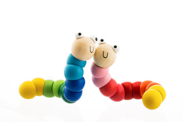 Happy wooden baby toys worms isolated on white
