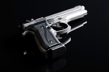 handgun on black background - obrazy, fototapety, plakaty