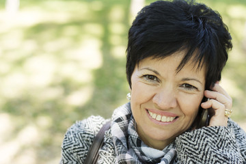 Senior woman using new technology devices