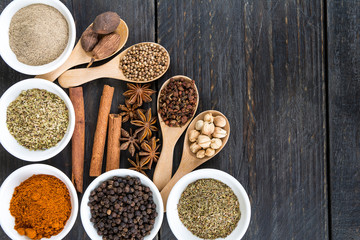 Spices and herbs in  bowls.