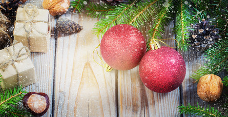 toys for the Christmas   tree and pine cones on old wooden background  new Year