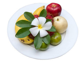 Leelawadee flower on fruits at white dish.