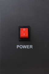 Red power switch in off position with power letter on on metallic color background