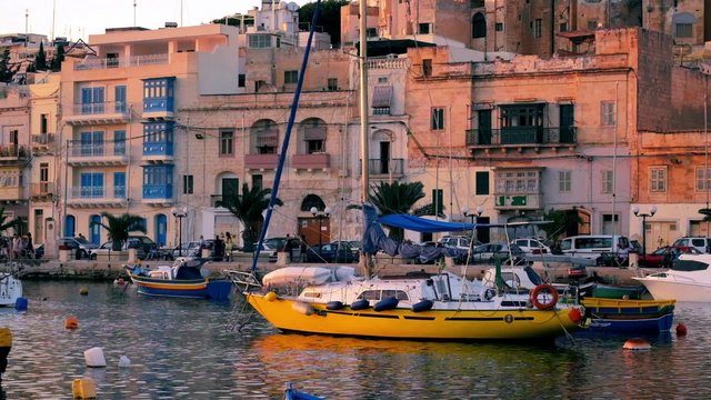 View on Malta bay between Kalkara and Birgu with yahts at evening time
