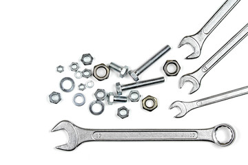 Bolts screws and washers on white background.