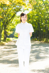 young asian nurse in the park