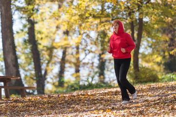 Fototapeta premium Woman running in park