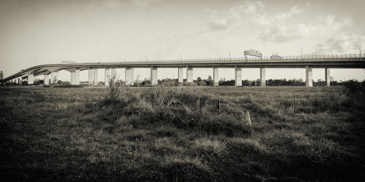 Fototapeta The Gateway Bridge (Sir Leo Hielscher Bridges) at sunset in Brisbane, Queensland, Australia. Abstract black and white image.