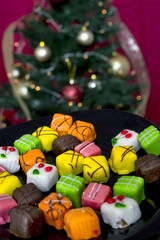 Christmas cakes in front of a Christmas tree