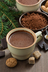 cup of hot chocolate and amaretti cookies on a wooden table