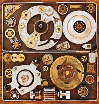 Older parts of mechanisms in the box. Abstract  collage of a mec