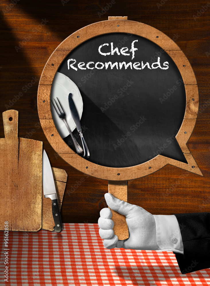 Aufkleber chef recommends - empty blackboard / hand of chef with white glove holding a pole with empty blackbo