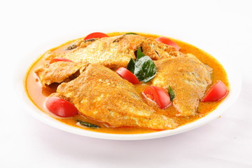 Spicy  fish curry served in plate.