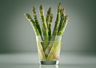 beam of asparagus in a glass