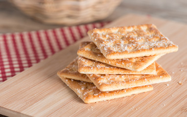 Cracker on wood table. Selective focus.