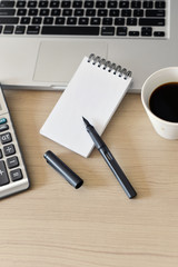 Blank Note Pad, Calculator, Computer, Pen on the Table